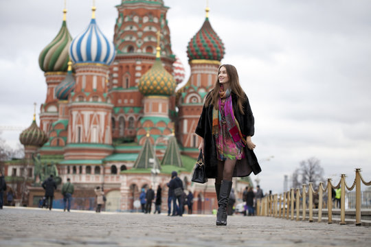 Young woman in a mink coat on the Red Square in Moscow