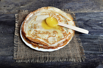 Pancakes with a wooden spoon 