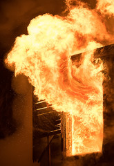 Huge Flame Distracting House on Fire. Fire Safety Concept