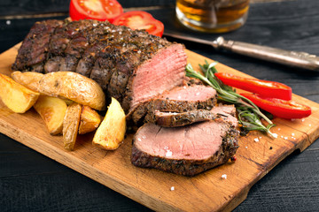 Grilled beef on a cutting board