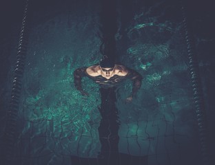 Man swims using breaststroke technique