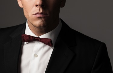 Sharp dressed fashionist wearing jacket and bow tie