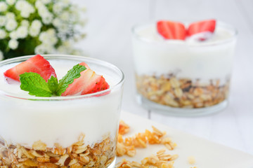 Yogurt with cereals and strawberries