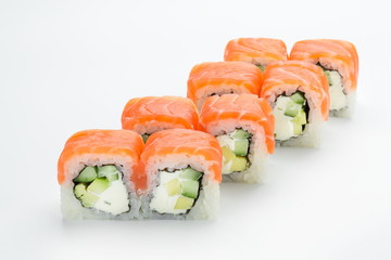 Sushi rolls with salmon, avocado, philadelphia and cucumber isolated on white background