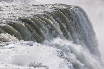 Niagara Falls Icy Waters Edge. Niagara Falls during a cold winter in January.