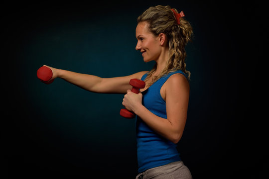 young woman exercising in the gym