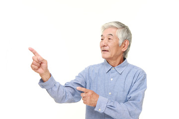 senior Japanese man presenting and showing something