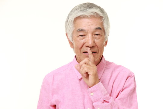senior Japanese man whith silence gestures