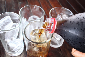 Cola with ice cubes