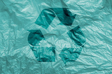 Recycling symbol on  plastic background