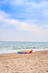 Fototapeta na wymiar Banana boat on the beach