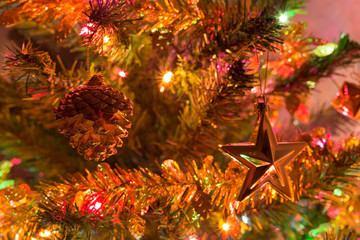 Obraz na płótnie Canvas christmas background, christmas tree decorated with twinkling