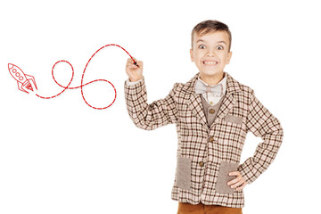 Portrait adorable young happy boy drawing and looking at camera