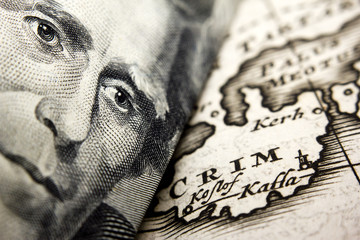 Close-up of a 20-dollar banknote (figuring president Jackson) and an old map of Crimea (Crim)