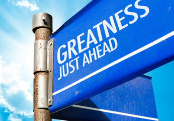 Greatness Just Aehad written on road sign