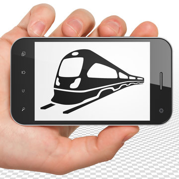 Tourism concept: Hand Holding Smartphone with Train on display