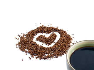 heart drawing on instant coffee powder and part of coffee cup isolated on white
