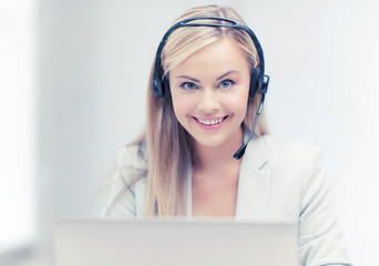 friendly female helpline operator with laptop