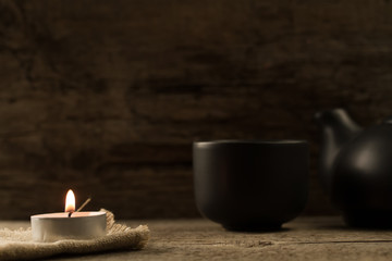  light  burning brightly candles on old wooden background. Spa, meditation, ritual, flavored.