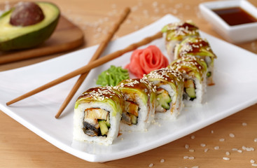 Green dragon sushi roll with eel, avocado, cucumber, wasabi and ginger.