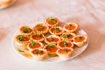 Tartlets with red caviar close up. Gourmet food closeup, appetizer