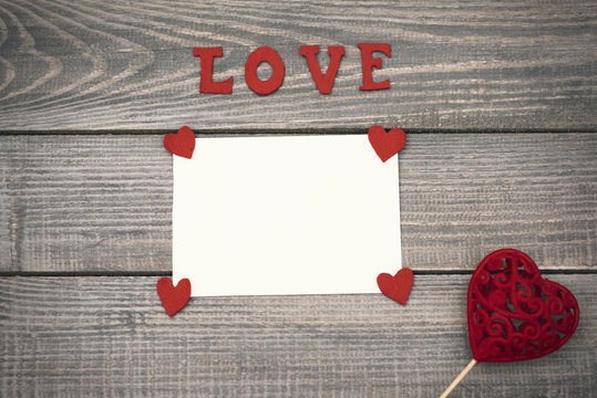 Valentine's day decorations on wooden board