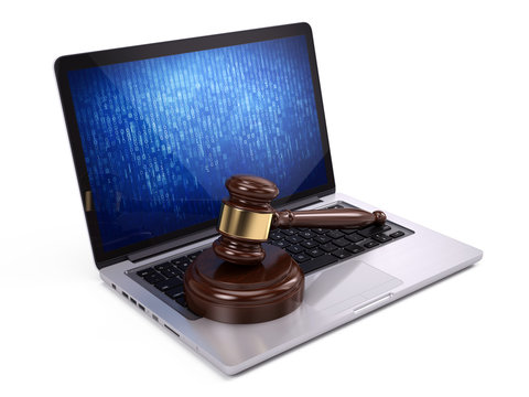 Law concept - Golden judge gavel on laptop