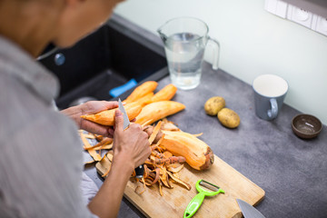 Young woman cooking in her modern kitchen 