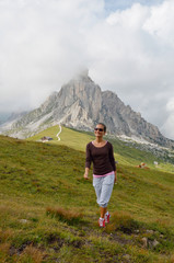 Naklejka na ściany i meble young woman tourist in alpine zone