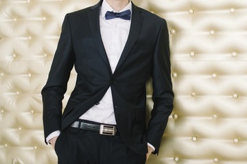 fashion man in tuxedo standing 