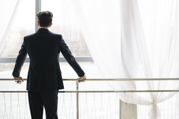 fashion man in tuxedo standing 