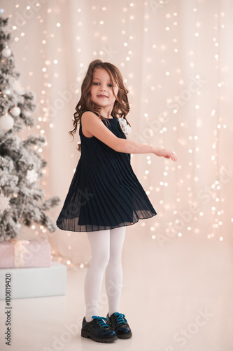 smiling baby girl 5 6 year old dancing in roomover christmas lights looking at - What To Get 6 Year Old Little Girl For Christmas smiling baby girl 5 6 year old dancing in roomover christmas lights looking at - What To Get 6 Year Old Little Girl For Christmas