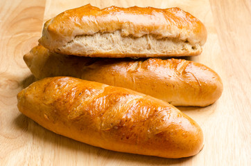 Fresh bread on wooden background
