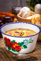 Sour soup with bread.