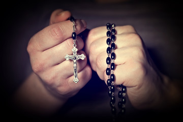  Caucasian  hands tighten  Christian rosary for prayer. religious belief  faith.