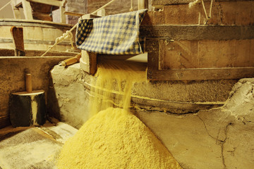 Old mill with millstone for grain