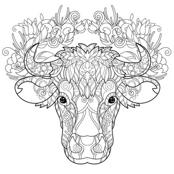 Hand drawn doodle outline cow head decorated with ornaments.Vector zentangle illustration.Floral ornament.