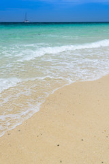 Fototapeta na wymiar SAND BEACH AND BLUE SEA - tropical sea, thailand