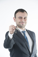 Businessman give metal home key