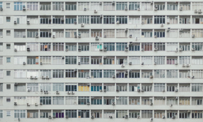 Fototapeta na wymiar Multiple closed windows on a large building