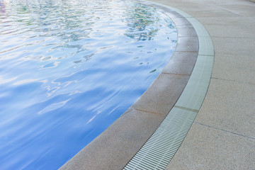 swimming pool edge with drainage ditch