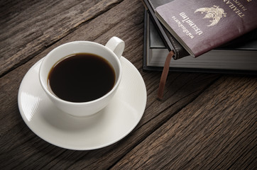 Cup off coffee on wooden deck tabletop