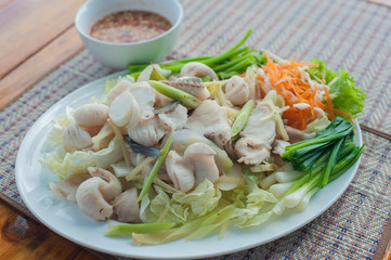 Boiled fish with Thai Spicy Sauce place on plate 