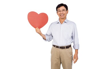 Older asian man showing heart