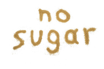word no sugar written with brown sugar