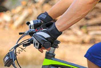 Wear gloves while riding a mountain biking for safety 