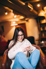 Obraz premium Attractive Smiling Young teenage girl texting