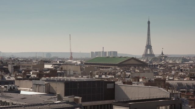 Roofs of Paris with Eiffel tower, pan - 60fps. The roofs of Paris with a pan camera to the Eiffel Tower. 1080p - 60fps