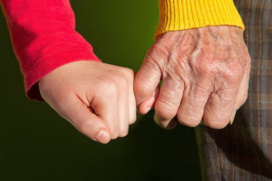hands of grandmother and grandchild