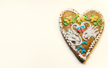 Cookies decorated with two swans and flowers  on white backgroun